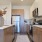 Sleek apartment kitchen with stainless steel appliances and white cabinetry in Lakewood.