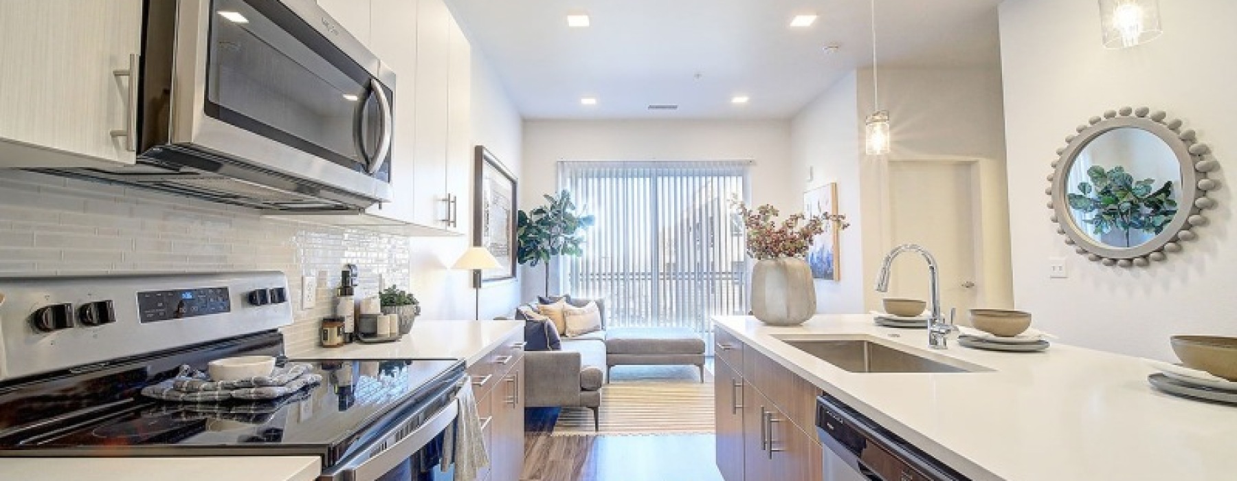 Modern apartment kitchen with steel appliances