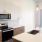 Well-lit, open concept kitchen with large island in our Lakewood CO apartments